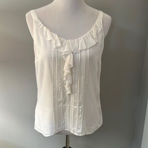 White House, Black market cream colored, silk camisole. Size small.